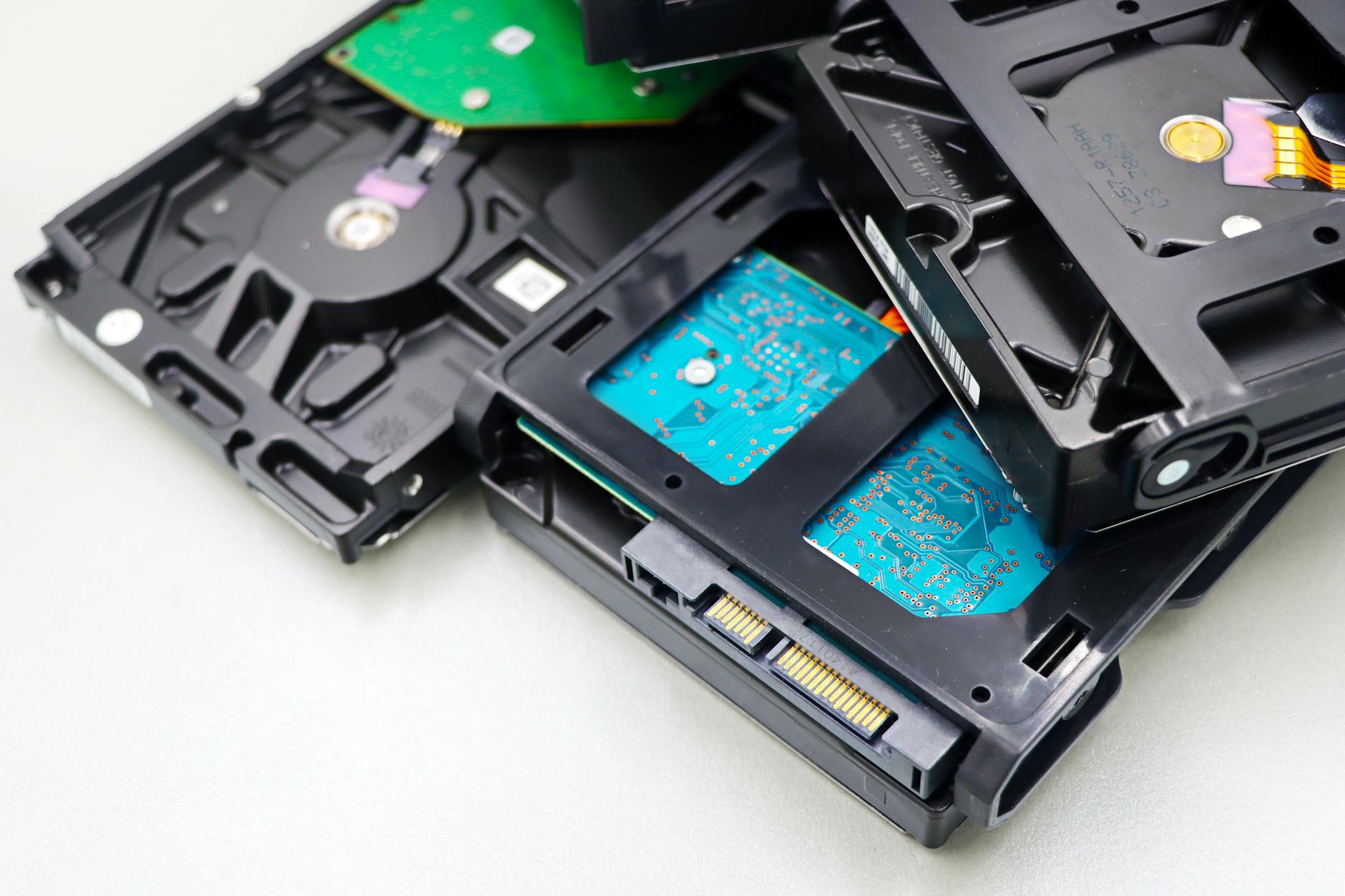 close up of hard disk drives on white surface